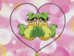 Animated gif: Two Victreebel forming a heart with their vines.