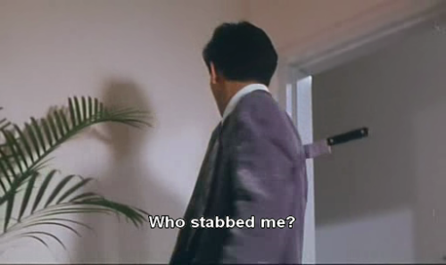 ID: A man with a knife in his back. Caption: Who stabbed me?
